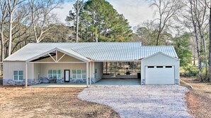 A single-story building with a garage and a covered porch.