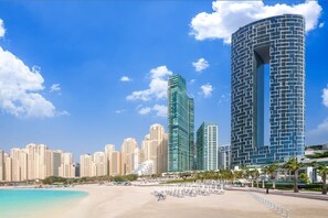 On the beach, sun-loungers, beach towels