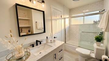 Shower, hair dryer, towels, soap