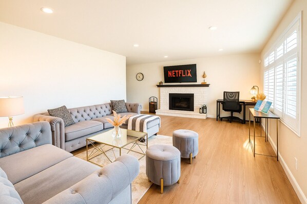 Smart TV, fireplace, table football, books