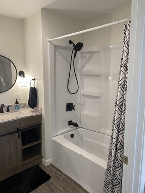 Shower, hair dryer, towels, toilet paper
