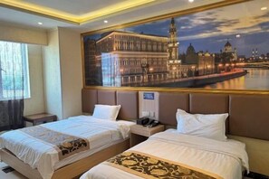 A hotel room with two beds, a large window, and a cityscape painting on the wall. - Hengshan Hotel (Taishan)