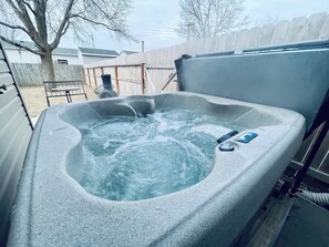 Outdoor spa tub - Luxury Suite • Private Yard • Hot Tub • King Bed (Sioux Falls)