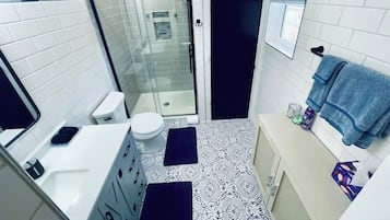 Shower, hair dryer, towels, soap