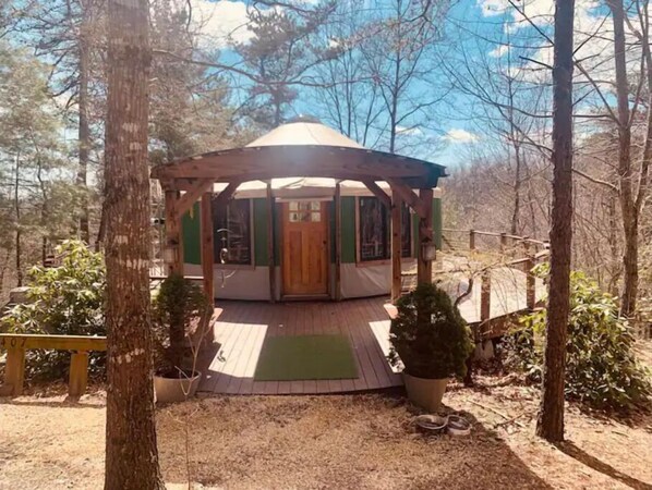 Escape to a serene gazebo surrounded by lush greenery and a tranquil atmosphere.
