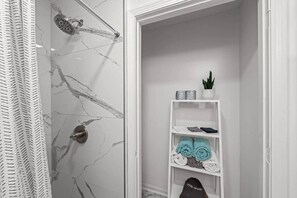 Shower, hair dryer, soap, shampoo
