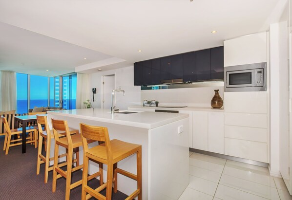 Fridge, microwave, oven, stovetop - Desirable level 17 Ocean View Two Bedroom in H-Residences (Surfers Paradise)