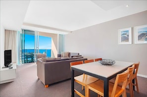 Enjoy ocean views from the large balcony, relax in the comfortable seating area, and dine at the dining table.