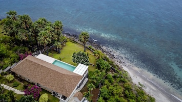 Drone view of the villa and natural surroundings 