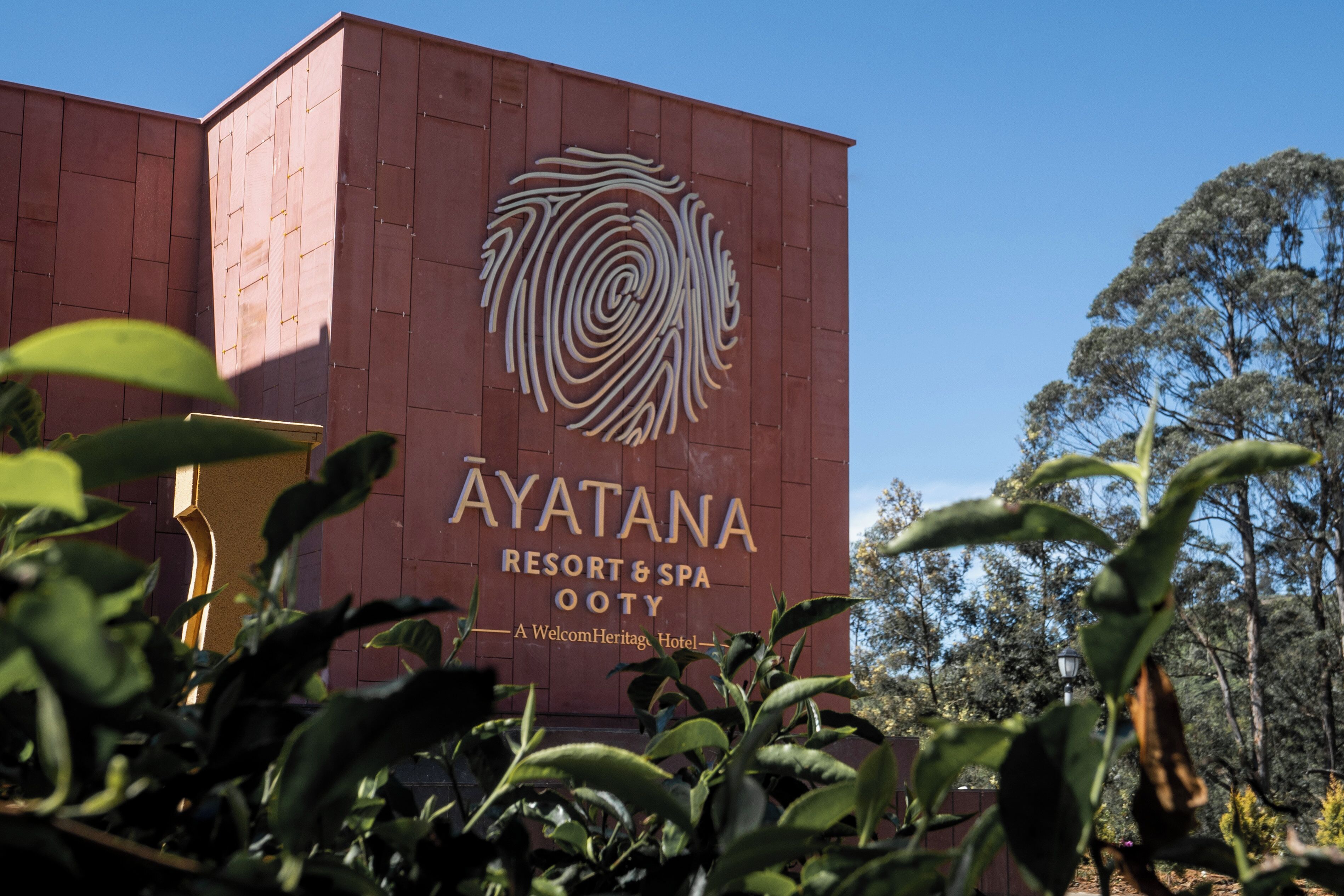 The exterior of Ayatana Resort & Spa, featuring a prominent logo and signage.