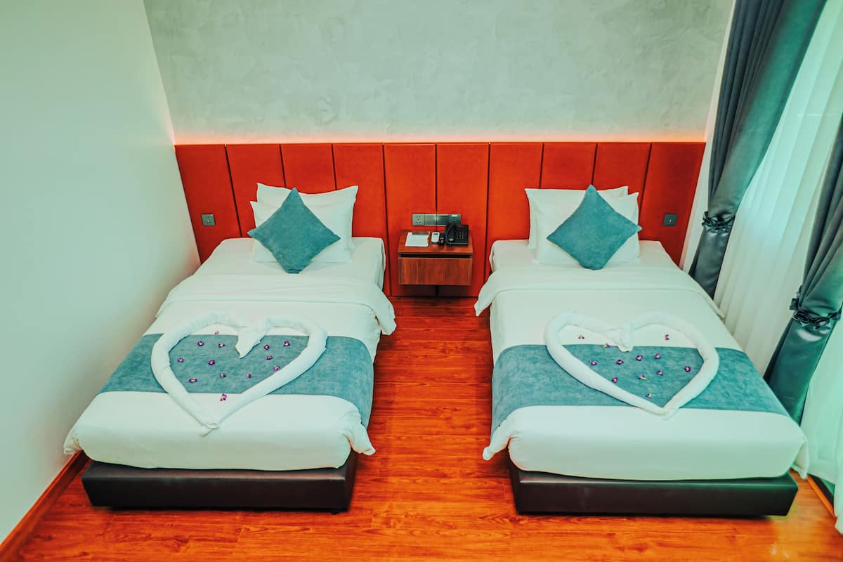 Deluxe Twin Room, 2 Bedrooms, Sea View | 1 bedroom, minibar, in-room safe, desk