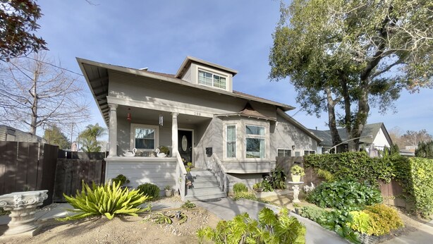 A two-story house with a front porch, a small garden, and a mailbox. - Silicon Valley Hideaway w/ Private Garden (San Jose)