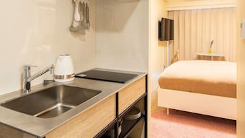 Base Studio Apartment | Private kitchen | Fridge, microwave, stovetop, electric kettle