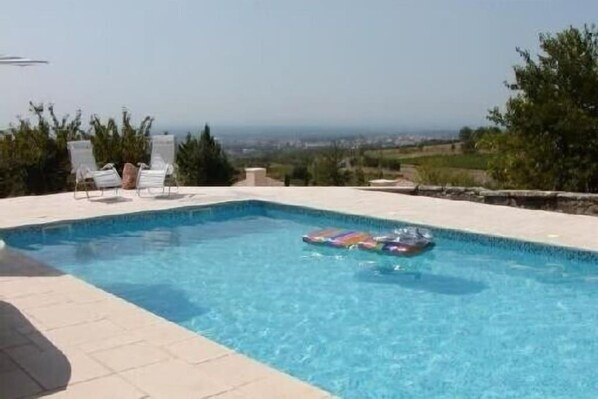 A swimming pool with a view of the landscape.