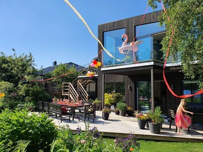 House with big garden by water