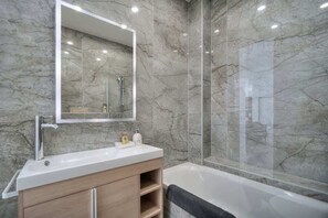 Shower, hair dryer, towels, shampoo