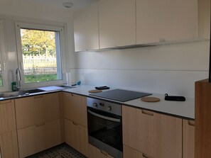 Fridge, oven, dishwasher, dining tables