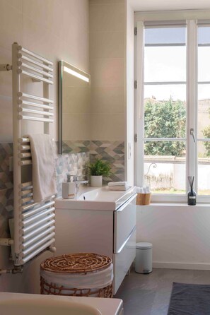 Shower, eco-friendly toiletries, hair dryer, bathrobes