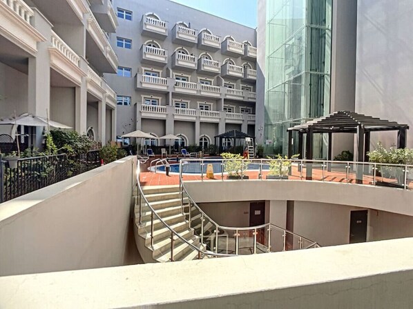 Exterior - Cosy 1 Bedroom l Ground Floor with Pool View (Jumeirah Village Circle)