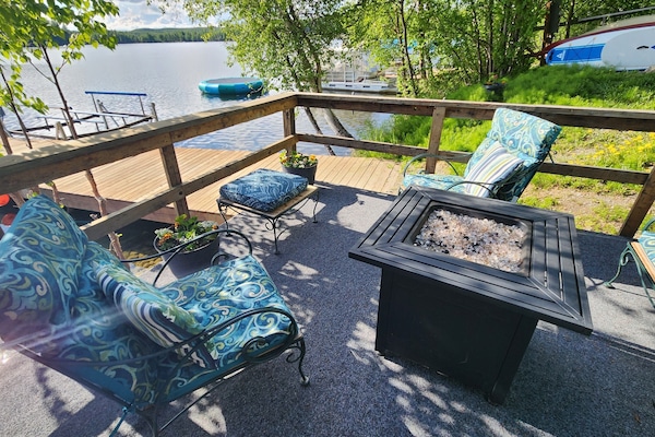deck with propane Firepit. please put chair covers and clips in the 5 gallon bucket on the porch when not in use. There is also a couch that matches the chairs, seat 5
