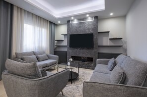 Luxury Apartment | Living area | 55-inch Smart TV with satellite channels, TV, Netflix - Vesta - New Cairo Residence (New Cairo)