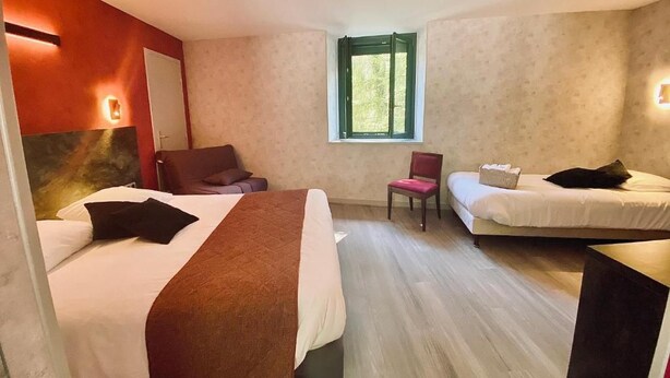 A hotel room with two beds, a chair, a small table, and a window. - Logis Hotel Altitude et Spa (Pexonne)