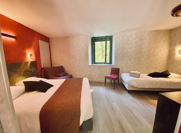A hotel room with two beds, a chair, a small table, and a window. - Logis Hotel Altitude et Spa (Pexonne)
