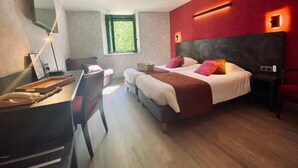 A modern bedroom with a large bed, a desk, and a window. - Logis Hotel Altitude et Spa (Pexonne)