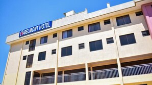 A hotel building with a sign reading "BELMONT HOTEL".
