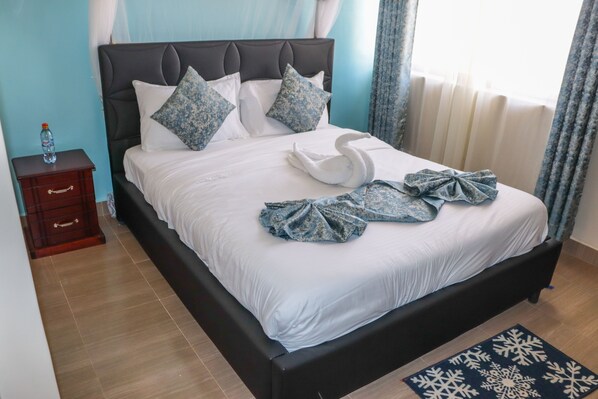 Premium bedding, desk, laptop workspace, free WiFi