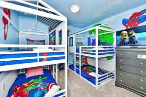 A children's room with bunk beds, a TV, and a dresser. - 5-Star Discounts, 5-Star Reviews! New Island Vacation Pool Home.2026 Specials (Davenport)