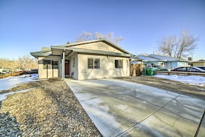 A single-story house with a front porch, a garage, and a driveway. - Gateway to Mt Rose Ski! Reno Home w/ Fireplace (Reno)
