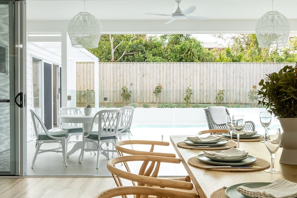 The doors leading outside to the backyard can be opened to invite the beauty of outside, inside.