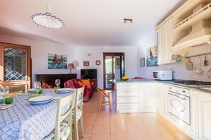 Fridge, cookware/dishes/utensils, dining tables