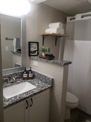 Hair dryer, towels, soap, shampoo
