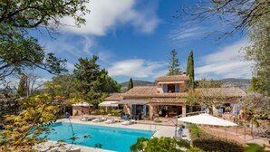 A villa with a swimming pool, outdoor seating, and a view of the surrounding landscape. - La Renardière by Interhome (Le Tignet)
