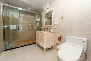 A bathroom with a glass shower enclosure, a white toilet, a vanity with a mirror, and a wall-mounted telephone. - Yaoli Holiday Hotel (Fuliang)