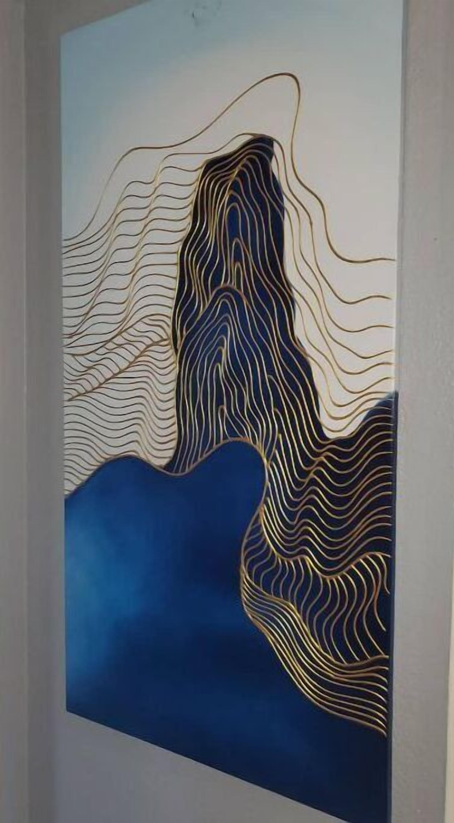 A wall with a large abstract painting featuring wavy lines and a blue background.