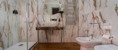 Junior Quadruple Room | Bathroom | Shower, rainfall showerhead, designer toiletries, hair dryer