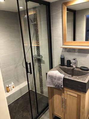 Shower, hair dryer, towels, soap