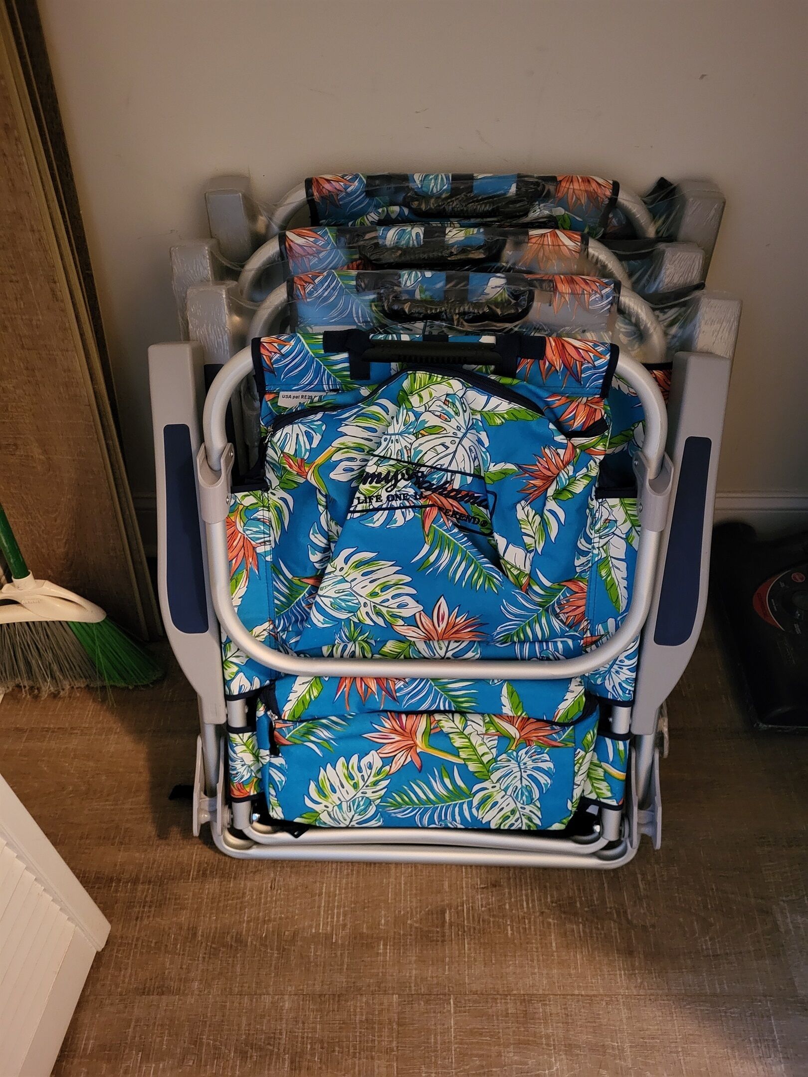 A wheelchair with a floral pattern and a handle.