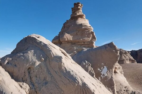 A rock formation with a layered structure. - Jiulong Holiday Hotel (Hami)