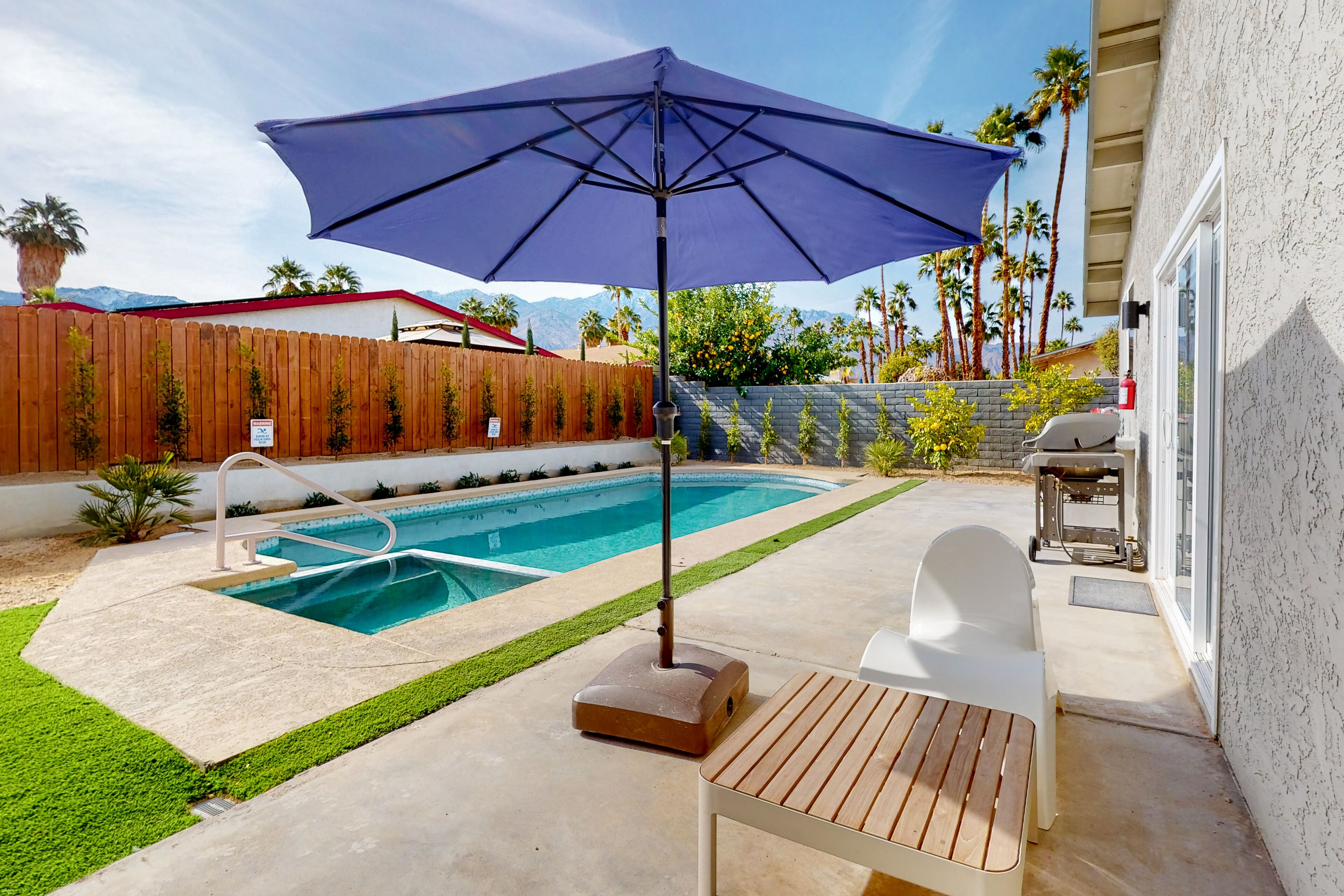 Sleek, dog-friendly home with enclosed yard, pool, AC, W/D & mountain view