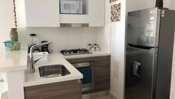 Fridge, microwave, coffee/tea maker, toaster