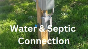 A utility pole with electrical boxes and a water meter, indicating RV utility access. - Gone Fishing on Lake Wateree (Liberty Hill)