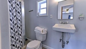 Shower, towels, soap, toilet paper