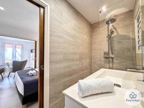 Shower, hair dryer, towels, soap