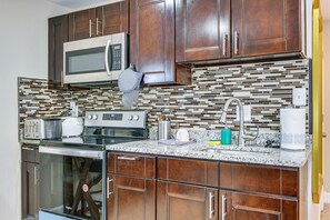 Fridge, microwave, stovetop, coffee/tea maker