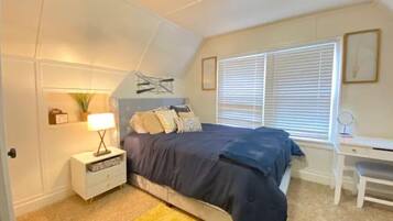 1 bedroom, desk, iron/ironing board, travel crib