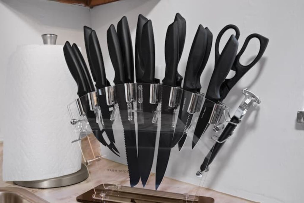 A knife block with various knives and scissors.